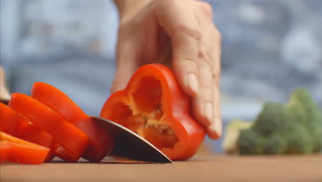 Red-pepper-cut-on-a-wooden-board-close-up.-shred.